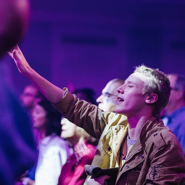 raising hands in worship